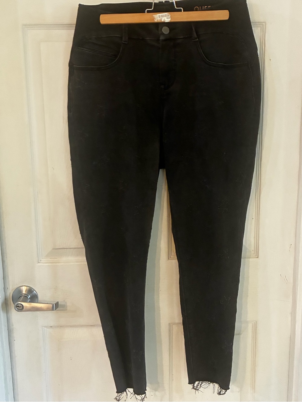 YSJ “Your Sexy Jeans" black wash ankle skinny jeans, featuring embroidered stars